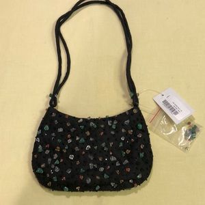 100% silk bag with Small stones attached 15 inches long 7 inches wide